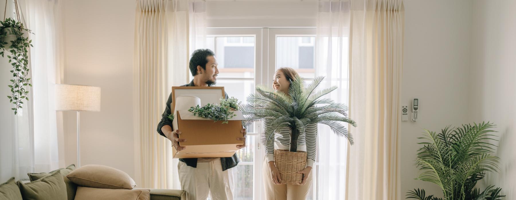 a man and woman holding boxes